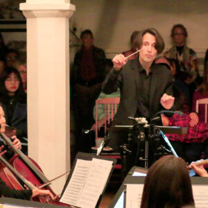 orchestra performing inside a hall