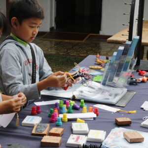 Kids assembling crafts on a table