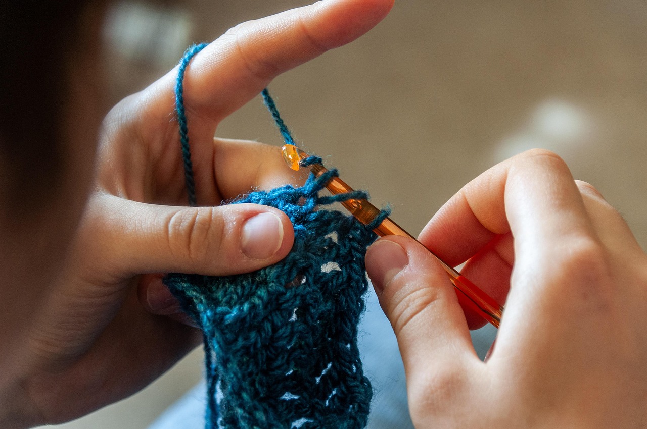 Person crocheting yarn
